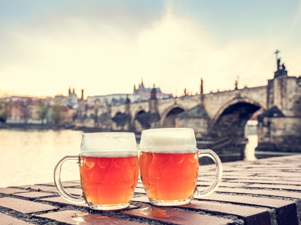 two glasses of beer on Charles Bridge, Prague