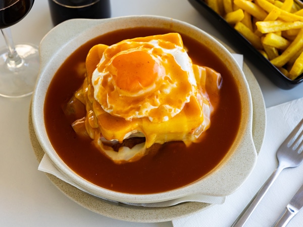 a plate of food at Francesinha, Porto