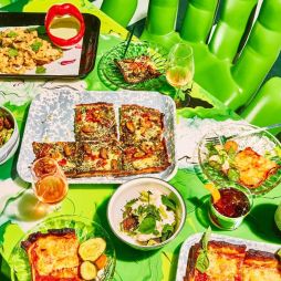 a wide selection of dishes on the green table at Shuggie’s Trash Pie and Natural Wine Bar