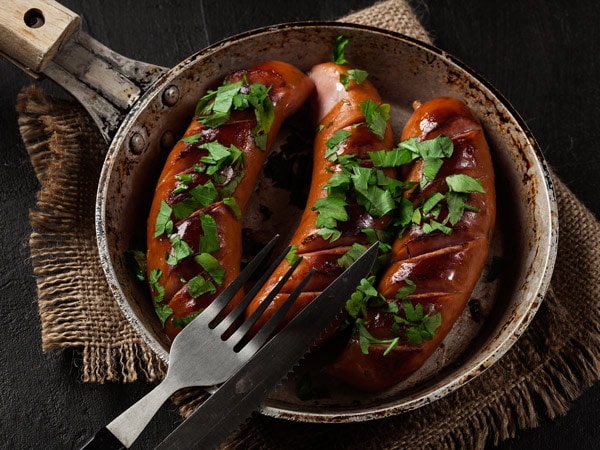 Klobásy or grilled sausages on a pan