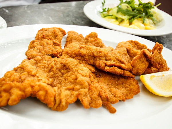 a plate of Řízek boneless meat in Prague