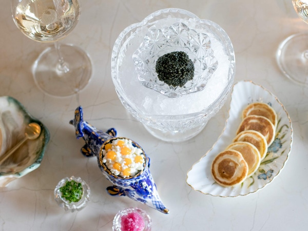 a table-top view of a caviar meal set at The Bump Bar