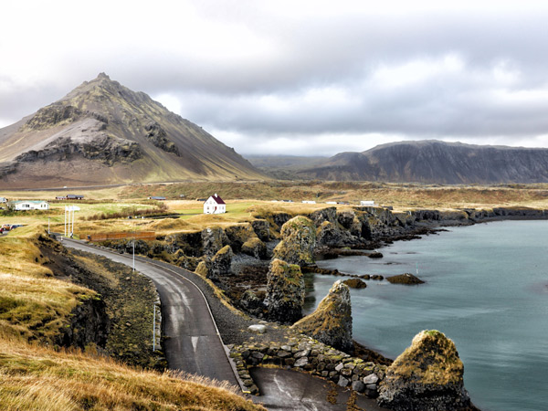 Arnarstapi and the volcanic mountain of Stapafell in Snaefellsjokull, Iceland