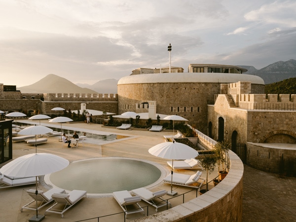 a top view of the pool area with sun loungers at Mamula Island