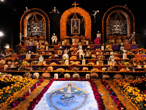 an elaborate altar in the Zócalo for the Día de los Muertos Festival in Oaxaca, Mexico