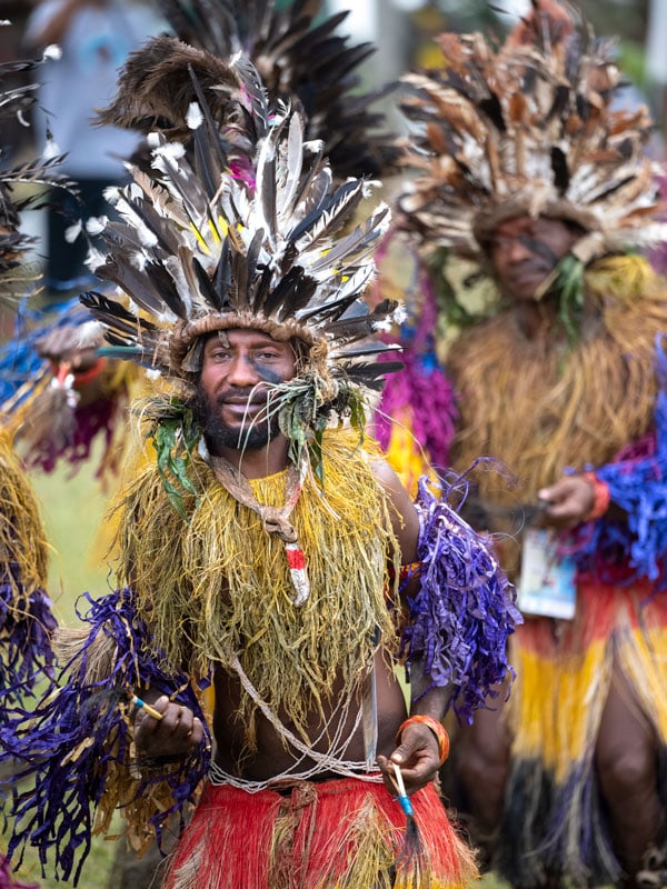Melanesian people in colourful costumes and headdresses in West New Britain, Papua New Guinea