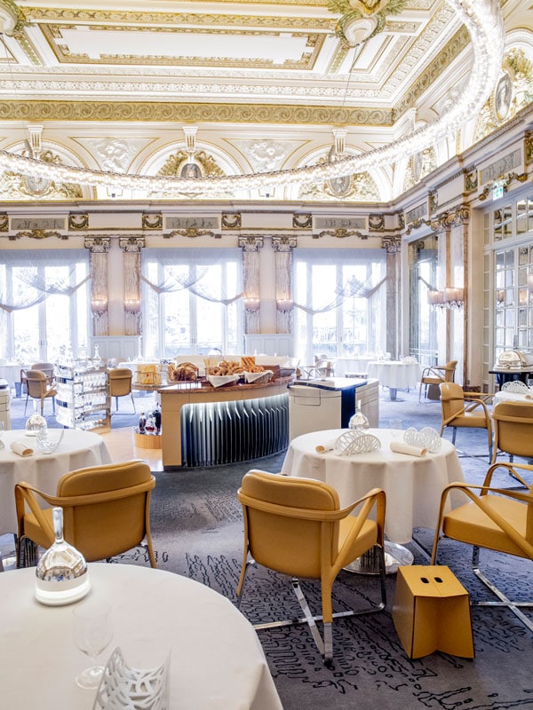 a luxury dining setup at Le Louis XV, Paris, France