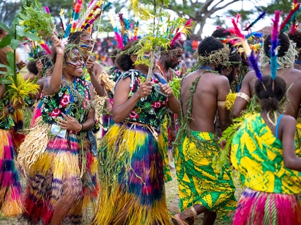 dancers in colourful costumes during the Melanesian Arts & Culture Festival