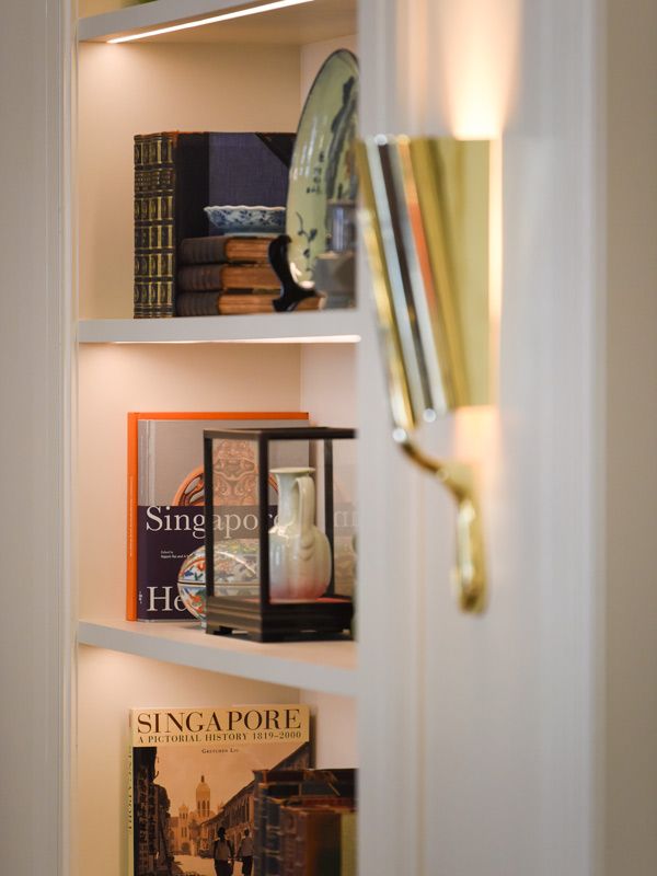 a book shelf inside a suite at Raffles Singapore