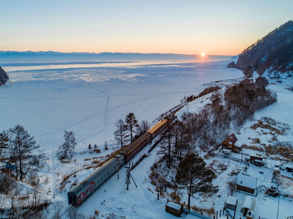 an aerial view of the snow-covered Trans-Siberian Railway, Russia
