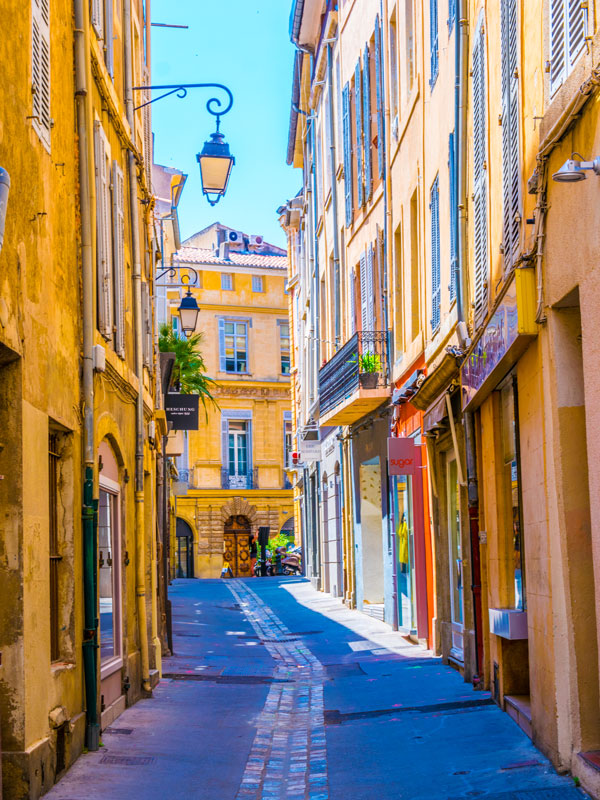 a narrow street in the center of Aix-en-Provence, France