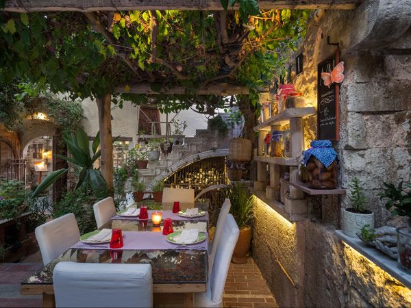 an al fresco fine dining setup at Avli Restaurant