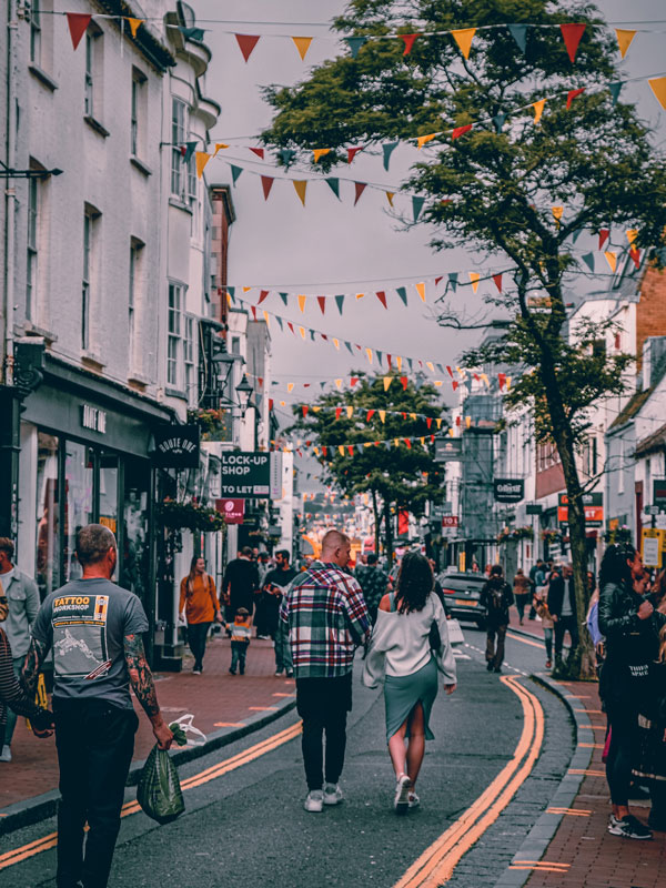 people strolling along the shops in Brighton
