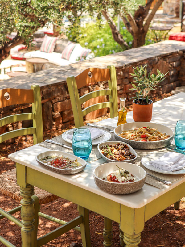 Cretan food on the table in an outdoor dining setup
