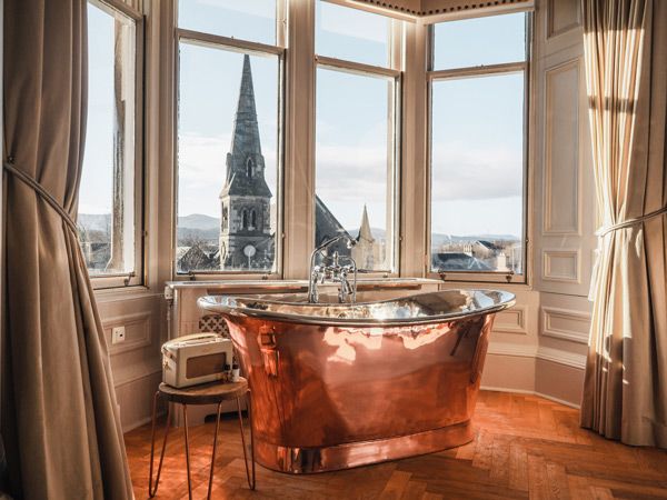 The Roseate Edinburgh copper bathtub with view