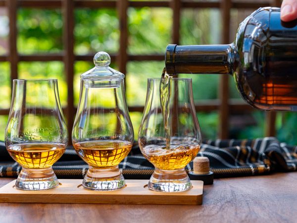 pouring scotch whisky into the glass