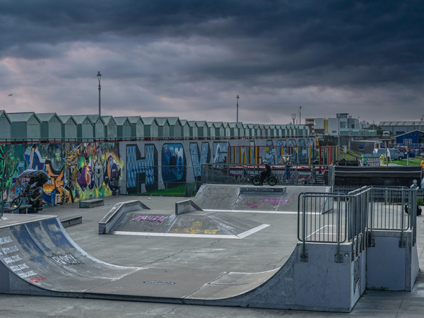 the skate park with beach huts and street art at Hove Lagoon