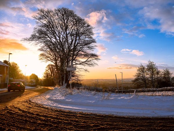 sunset on a snowy hill in Belfast