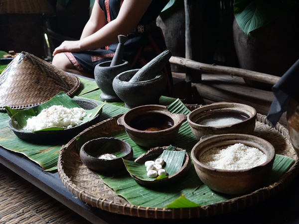Dusun tribe making rice wine by hand