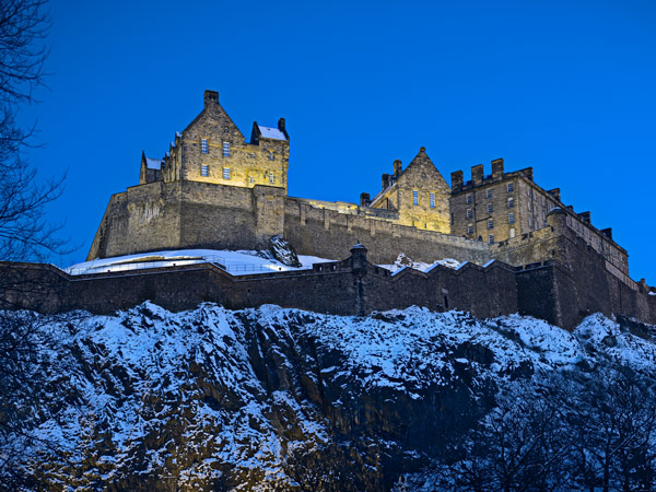 Edinburgh Castle at dusk with winter snow