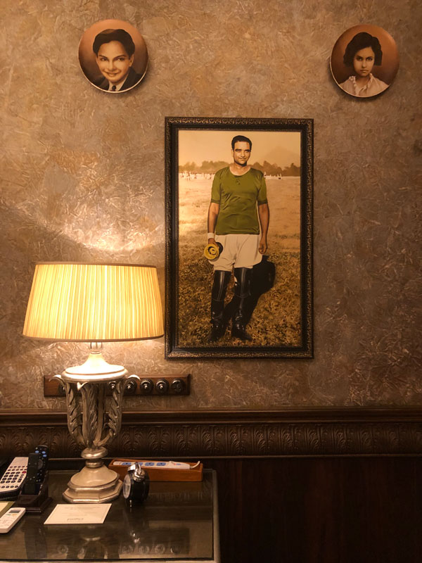 a portrait on the wall at Taj Rambagh Palace