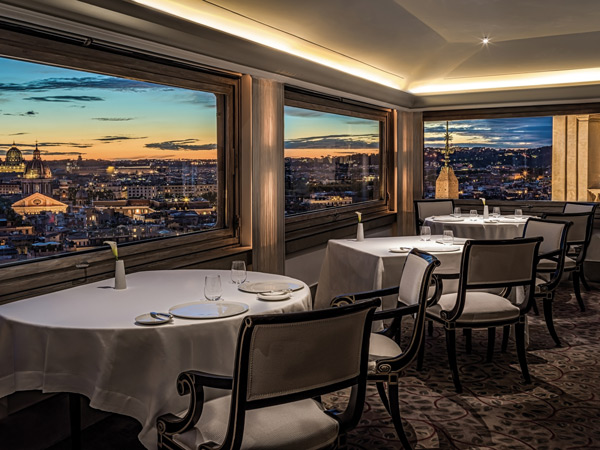 a restaurant with views of the city at Hassler Roma