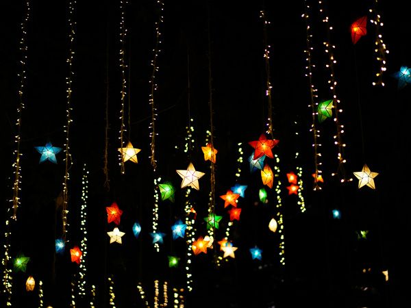 traditional star-shaped parols at night