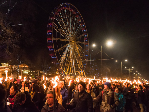 crowds of people joining the Edinburgh Hogmanay torchlit procession