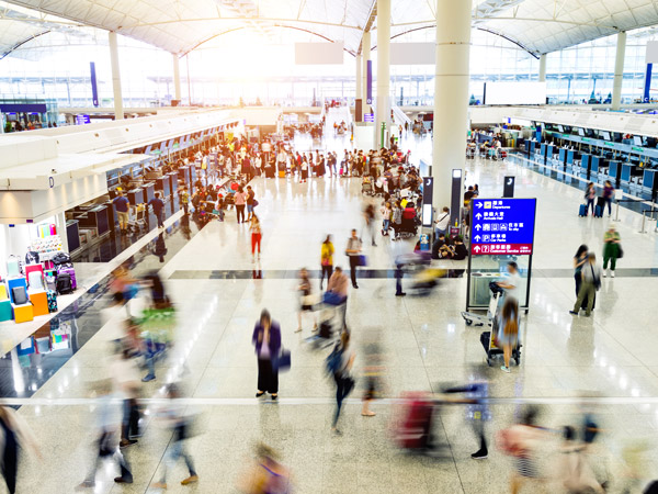 people moving back and forth at the airport