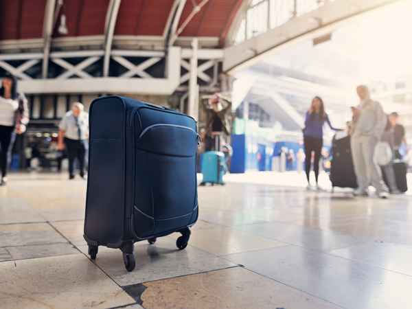 a blue luggage at the airport