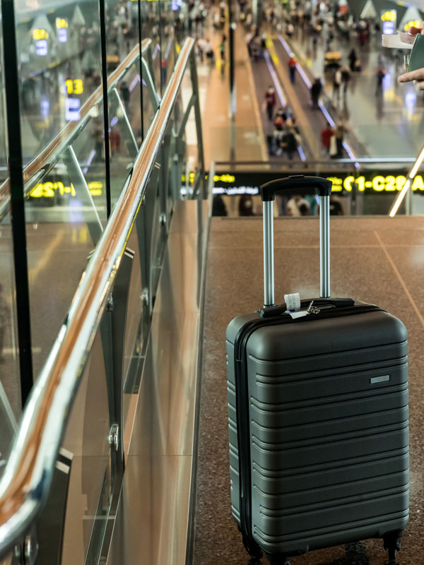an unattended suitcase luggage in airport terminal