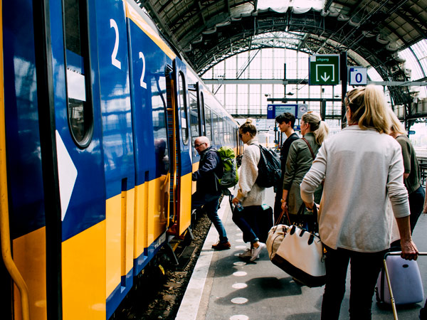 friends getting on the train in Amsterdam