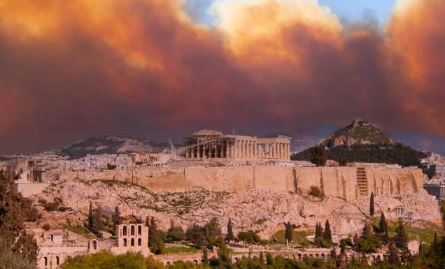 View of the Acropolis and the Parthenon against the background of smoke from fires in Athens