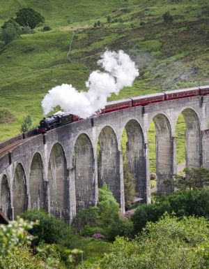 The Jacobite going over the Glenfinnan Viaduct in Scotland
