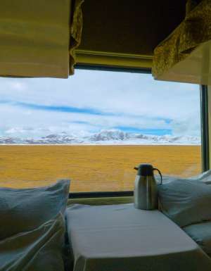 a sleeper train crossing the scenic Tibetan landscape