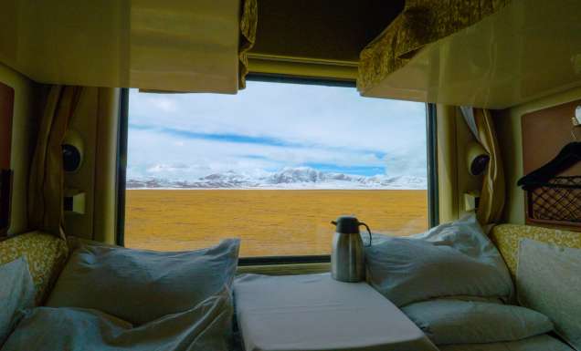 a sleeper train crossing the scenic Tibetan landscape