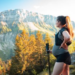 a pregnant woman hiking through the Pointe de Sur Cou Mountain in France
