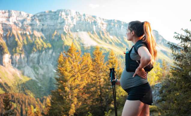 a pregnant woman hiking through the Pointe de Sur Cou Mountain in France
