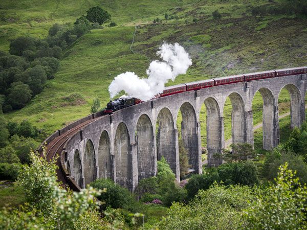 The Jacobite going over the Glenfinnan Viaduct in Scotland