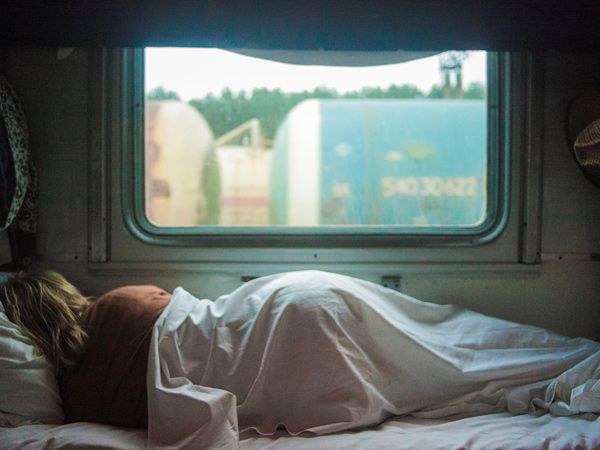 a person sleeping on a train