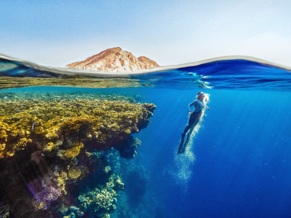 snorkelling in the clear blue waters