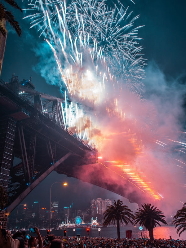 a close-up shot of Sydney NYE fireworks over the Harbour Bridge