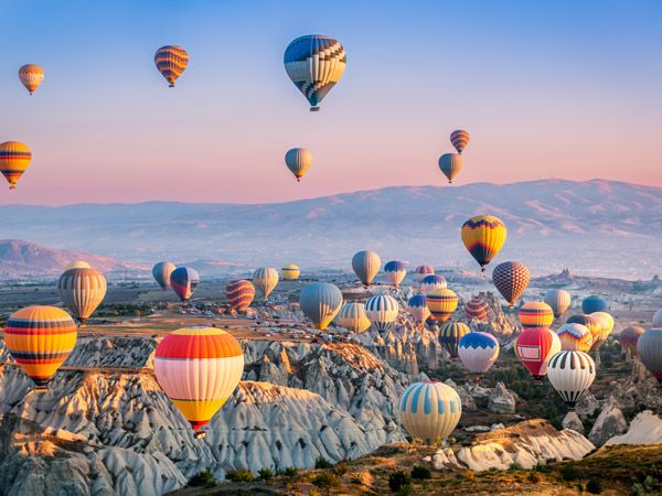 a spectacular landscape of hot air balloons at Cappadocia