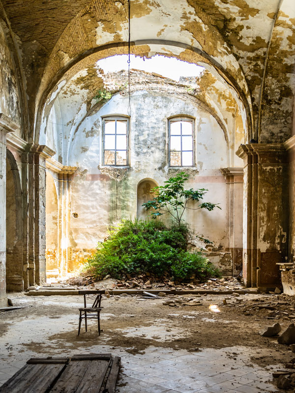 the interior of an abandoned church in Craco, Italy