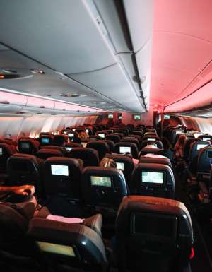 Chairs in aeroplane cabin with some reclined