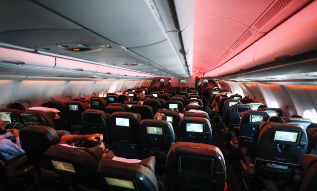 Chairs in aeroplane cabin with some reclined