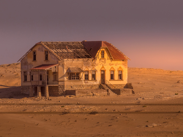 an old house alone in the desert in Kolmanskop, Namibia