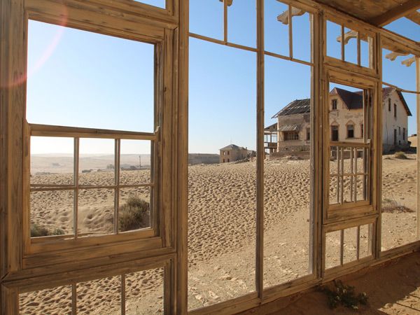 open windows of an abandoned building in Kolmanskop, Namibia