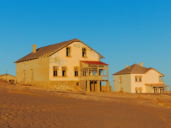 two huge abandoned houses in Kolmanskop, Namibia