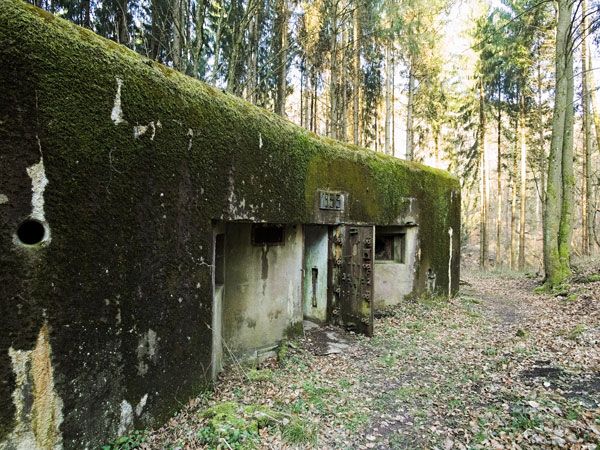 the moss-covered entrance of Maginot Line in France